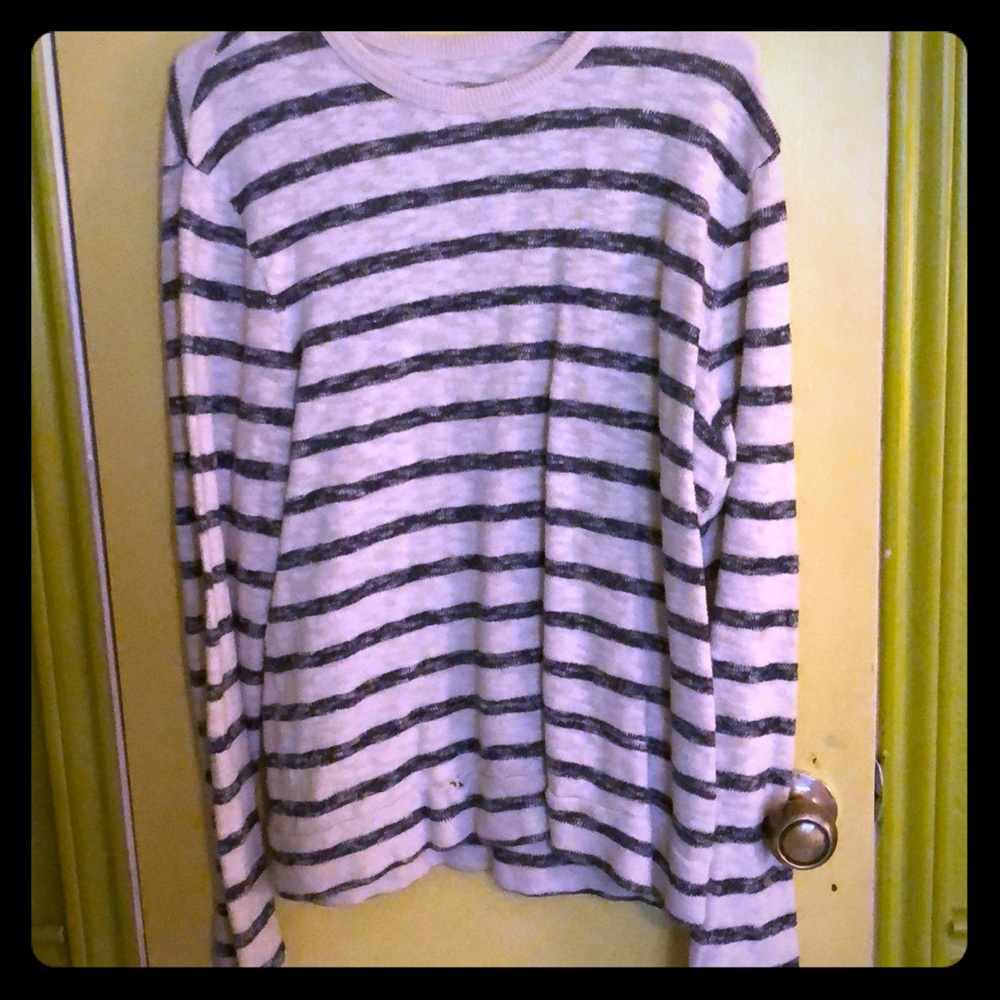 Men’s long sleeve, blue striped shirt.